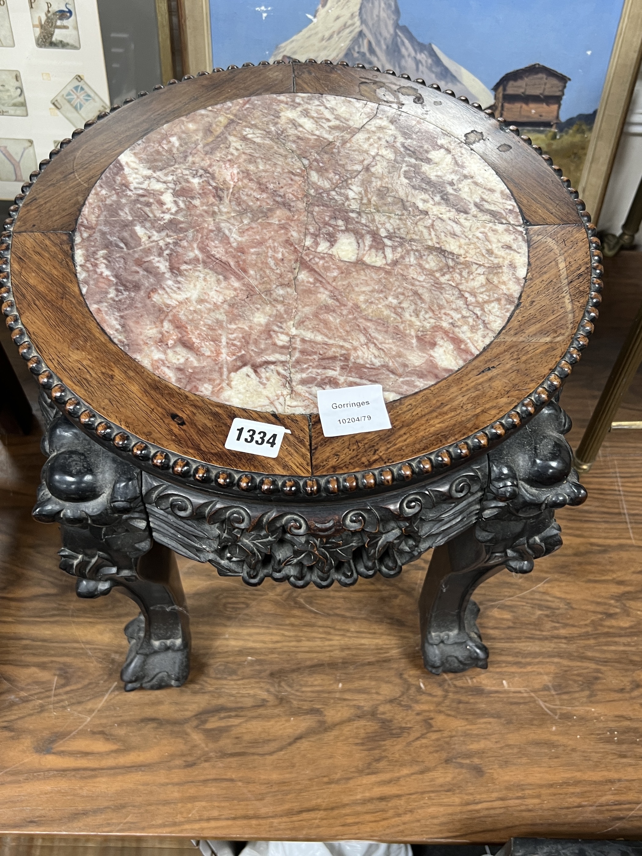 A Chinese circular hongmu and marble top vase stand, width 50cm, height 46cm